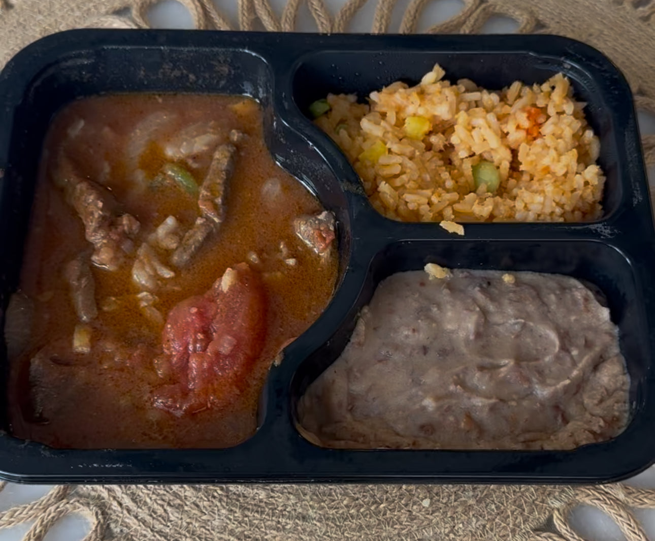 Ranchero Steak Plate – Ranchero steak, red rice, and refried beans